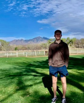 Cooper standing on golf course, Tubac, Arizona.